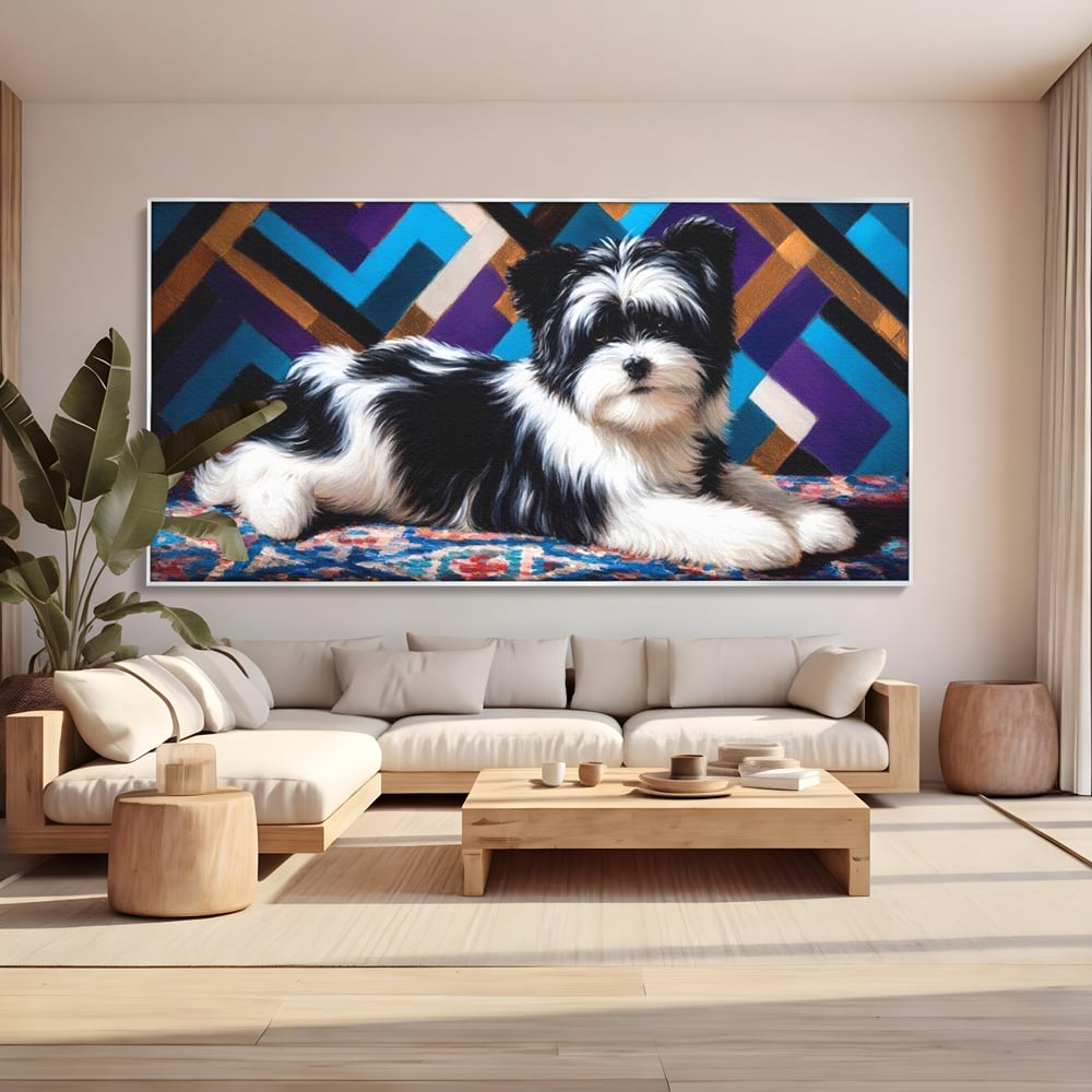Tablou canvas cu tablou canvas cu catel pufos alb-negru, in rama de aluminiu argintiu, pe perete intr-un living